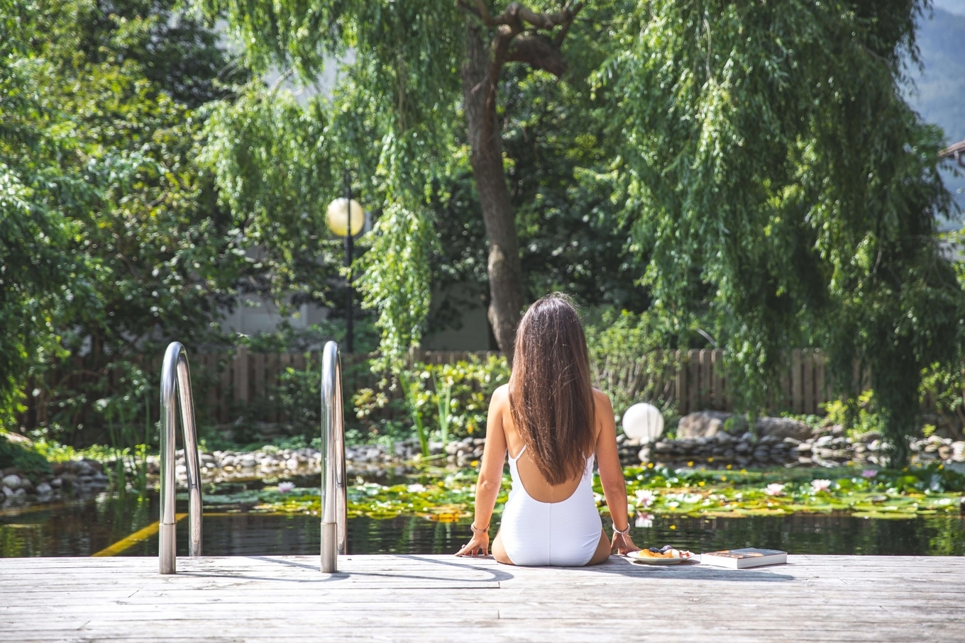 sitting by pool at La Vimea